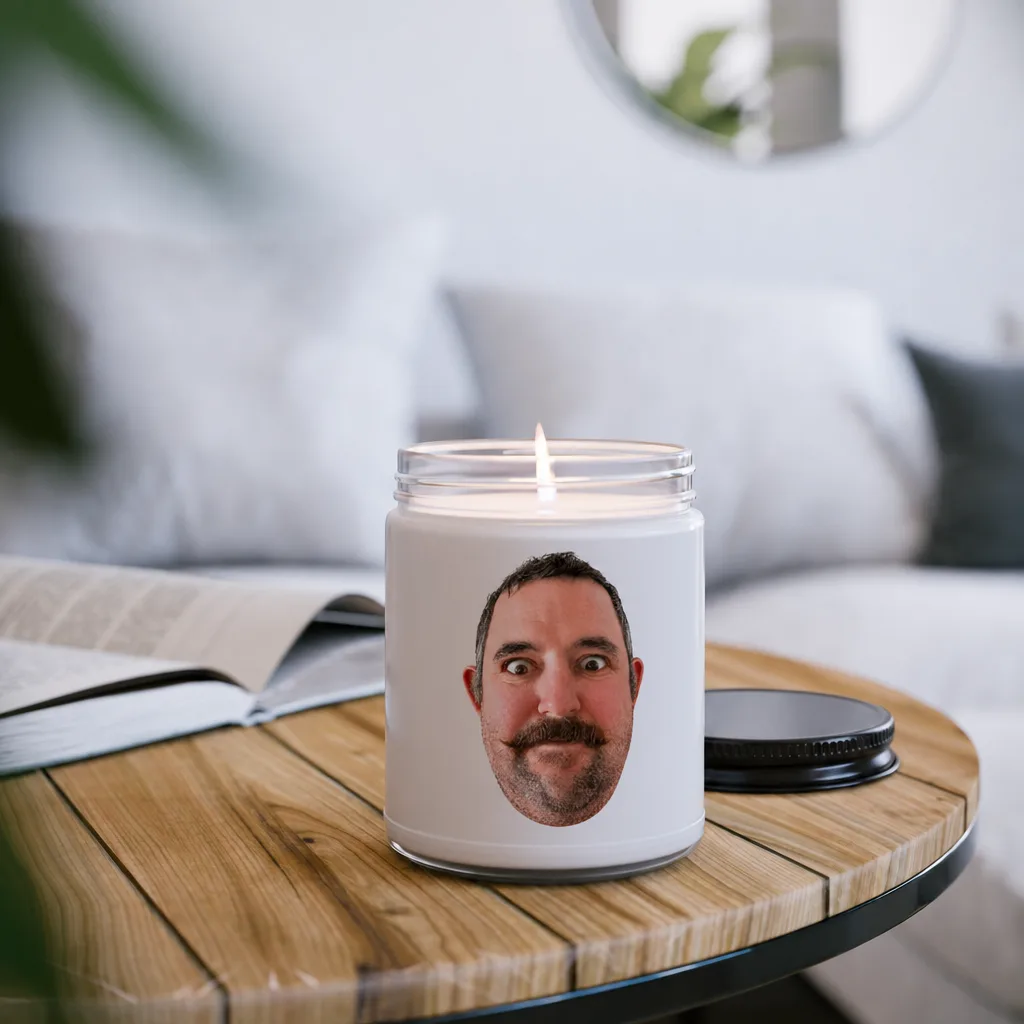 The candle lit on a side table, our picture printed around the jar.