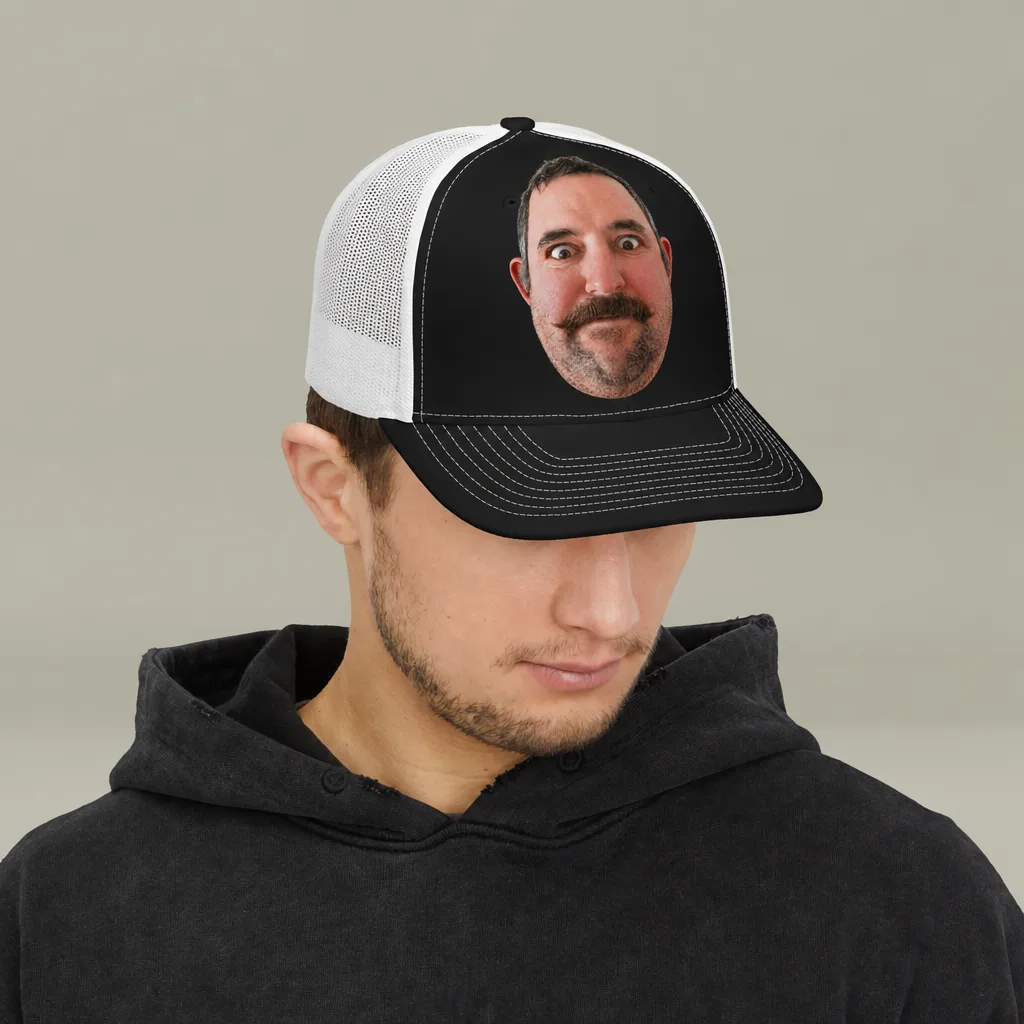 Someone wearing the black trucker cap, our picture printed on the front panel.