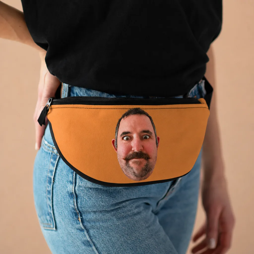 The orange fanny pack worn at the hip, our picture printed across the front.