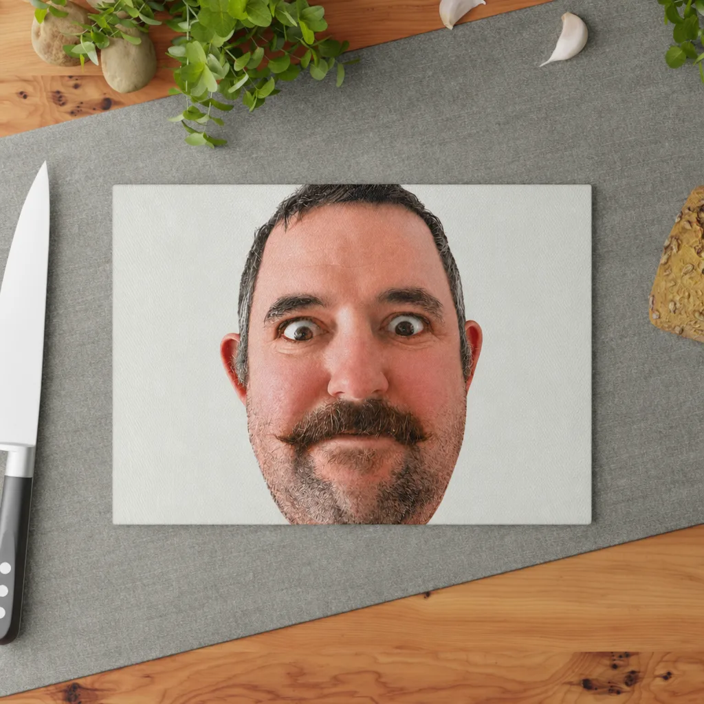 The glass cutting board on a kitchen counter, our picture printed across it.